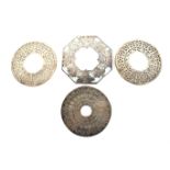 Three silver and glass mounted coasters and a similar plated example.