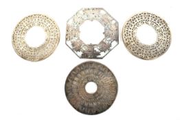 Three silver and glass mounted coasters and a similar plated example.