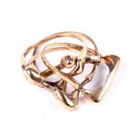 A vintage 9ct gold four-piece puzzle ring.