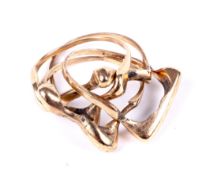 A vintage 9ct gold four-piece puzzle ring.