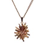 A 9ct gold abstract star-burst pendant necklace.
