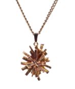 A 9ct gold abstract star-burst pendant necklace.