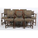 Seven Edwardian oak upholstered dining chairs.