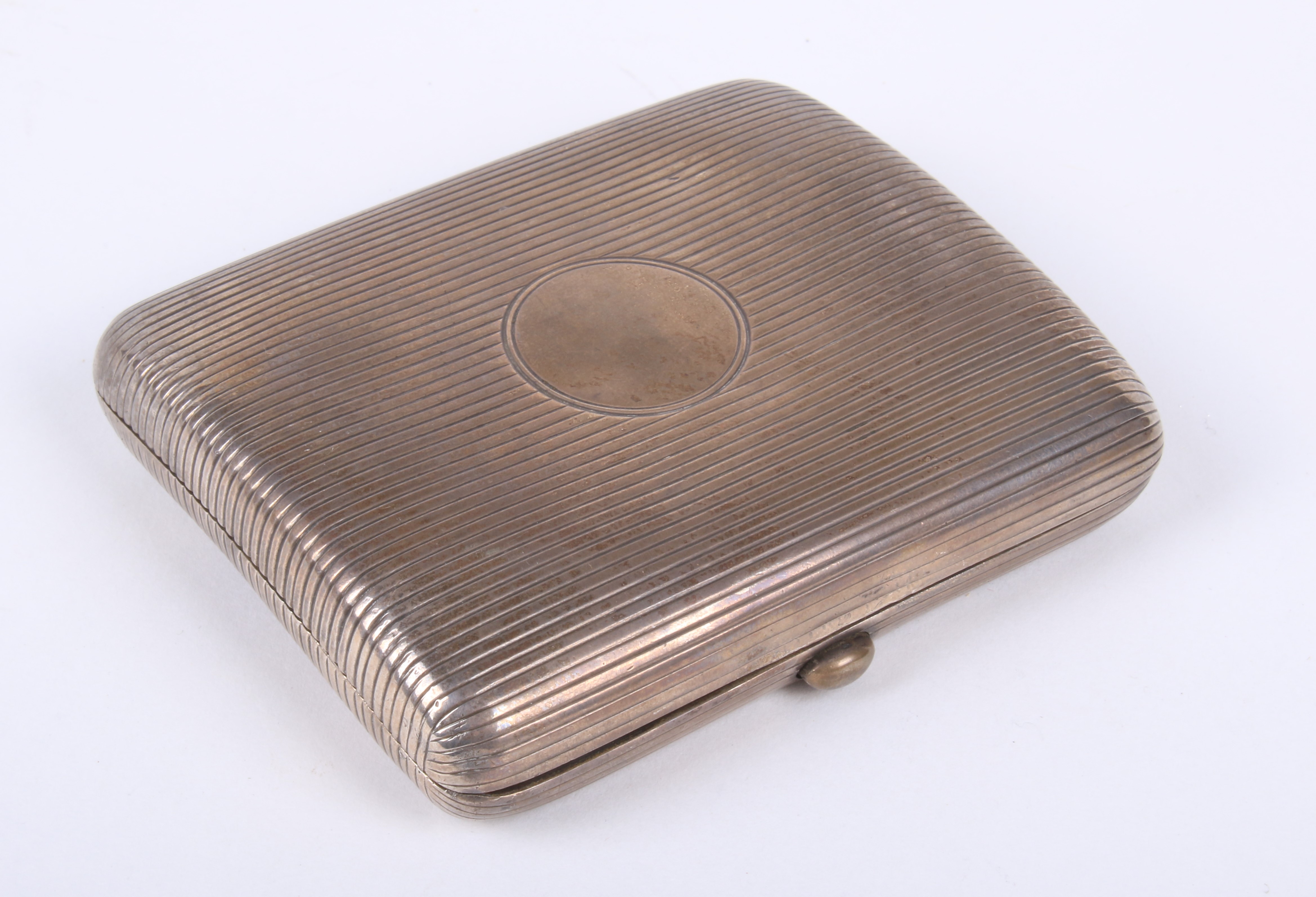 An Edwardian silver cigarette case.