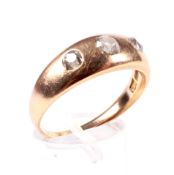 A late Victorian/early 20th century gold and diamond three stone gypsy ring.
