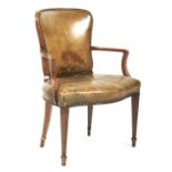 An early 20th century leather upholstered arm chair.