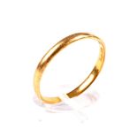 A 22ct gold wedding band. Hallmarks for London 1968 (part obscured), 2.5mm wide, size T, 2.