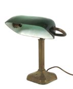 An early 20th century brass and green glass banker's desk lamp.