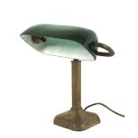 An early 20th century brass and green glass banker's desk lamp.