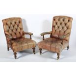 A pair of Victorian button back leatherette upholstered armchairs.