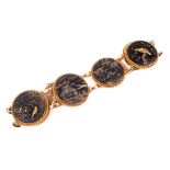 A late Victorian gold and Japanese shakudo panel bracelet. The six round shakudo panels approx.