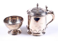 A silver mustard pot and a footed condiment bowl.