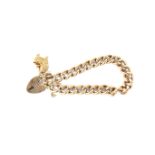 A 9ct gold heart locket charm bracelet. With one hanging charm in the form of a childs cot, 24.