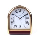 A contemporary Cartier Swiss made travel alarm clock.