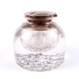 A large silver-mounted cut glass inkwell.
