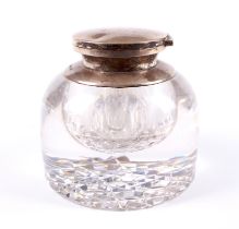 A large silver-mounted cut glass inkwell.