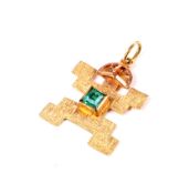 A vintage Inca/Mayan yellow metal and emerald pendant.