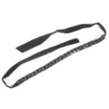 A vintage jet choker necklace of twenty six square cut beads mounted on a black-velvet ribbon,