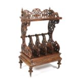 A mid Victorian inlaid walnut veneered etagere canterbury.