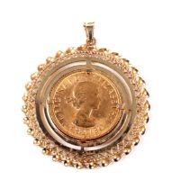 A sovereign, 1968, loosely mounted in a 9ct gold decoratively pierced round pendant mount.
