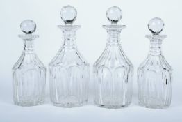 A set of four Georgian cut glass decanters.