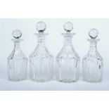 A set of four Georgian cut glass decanters.