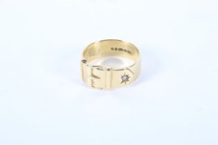 A gents 9ct gold buckle ring. Set with a single white stone, ring size U, 7.