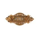 A late Victorian gold and half-pearl brooch.