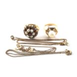 A 9ct gold garnet and seed pearl set dress rings, a gold pearl set dress ring,