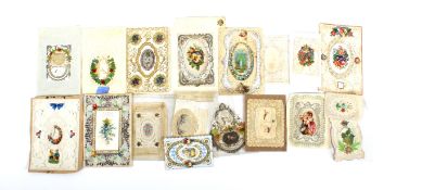 A collection of Victorian paper lace valentines and Christmas cards.