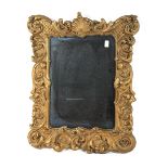 A 20th century giltwood and gesso rococo-style mirror frame.
