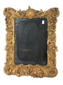 A 20th century giltwood and gesso rococo-style mirror frame.