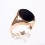 A gentleman's 9ct gold and black onyx oval signet ring. Hallmarks for London 1969, size X, 5.