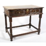 A 17th century oak side table.