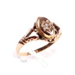 An early 20th century gold and diamond single stone oval panel ring.