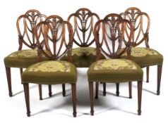 A set of five mahogany Hepplewhite-style dining chairs, 20th century.