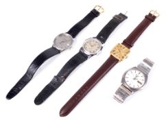 A collection of four gents wrist watches.