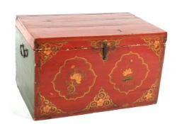 A vintage Chinese style red and gilt lacquered blanket chest and hinged cover.