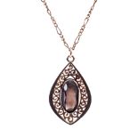 A 9ct gold and smokey quartz drop-shaped pendant and necklace.