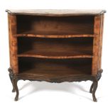 A Victorian walnut serpentine bookcase.