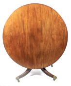 A large Victorian mahogany tilt top dining table.