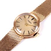 A vintage ladies 9ct gold Tissot manual wind wristwatch.