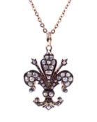 A fleur-de-lys pendant and chain.