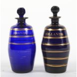 Two Regency Bristol blue barrel-shaped decanters and stoppers.