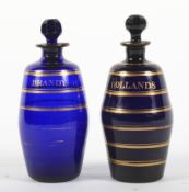 Two Regency Bristol blue barrel-shaped decanters and stoppers.