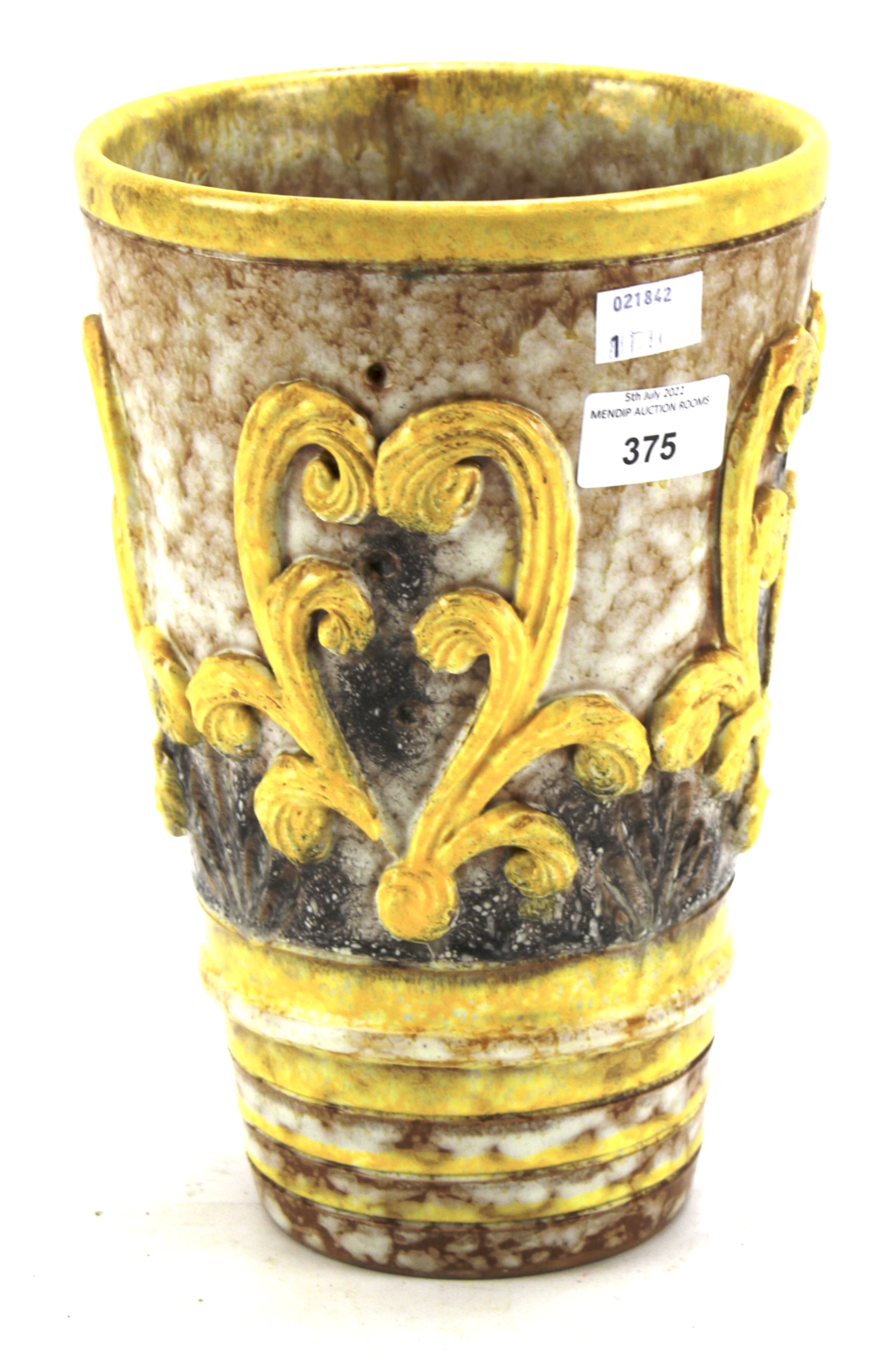 An Italian pottery cylindrical relief-moulded vase.