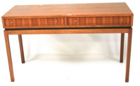 A 1970s teak side table.