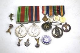A collection of badges and medals.