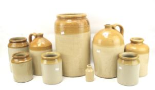 A collection of salt glazed stoneware pots and flagons.