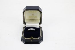A 9ct white gold gem set ring.